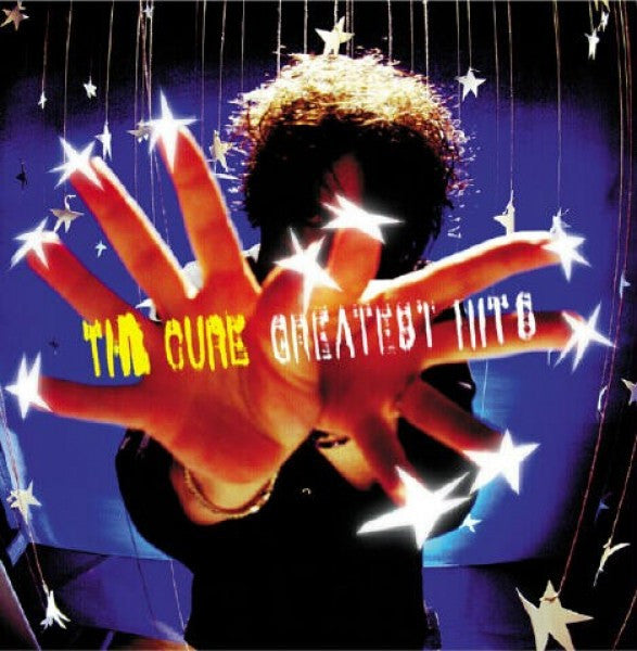 Album cover for 'The Cure Greatest Hits' with a hand and stars