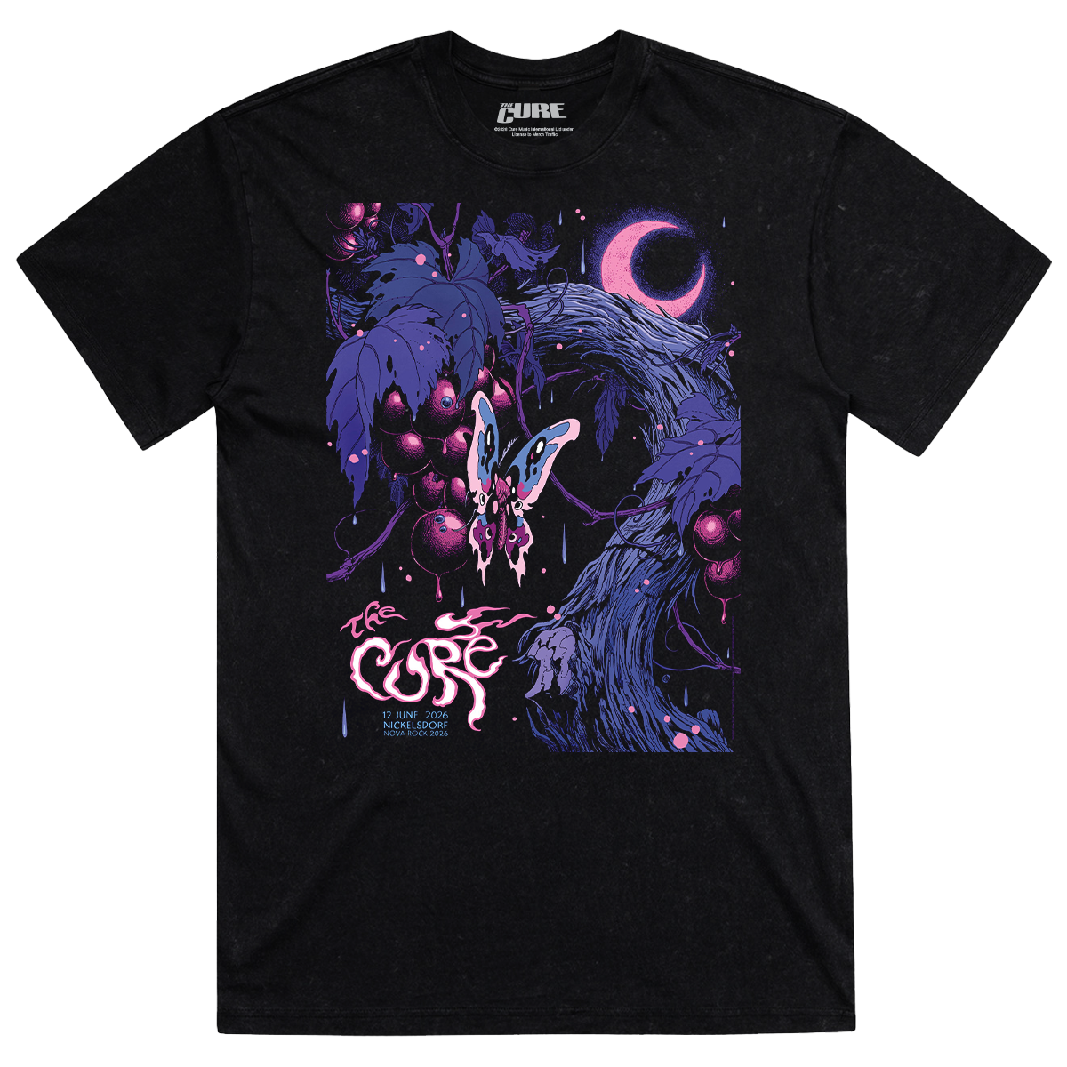 Black shirt featuring artwork of a pink and purple butterfly landing on a branch of berries under a pink and purple crescent moon, with "The Cure" logo and Nickelsdorf event details on the bottom right. 